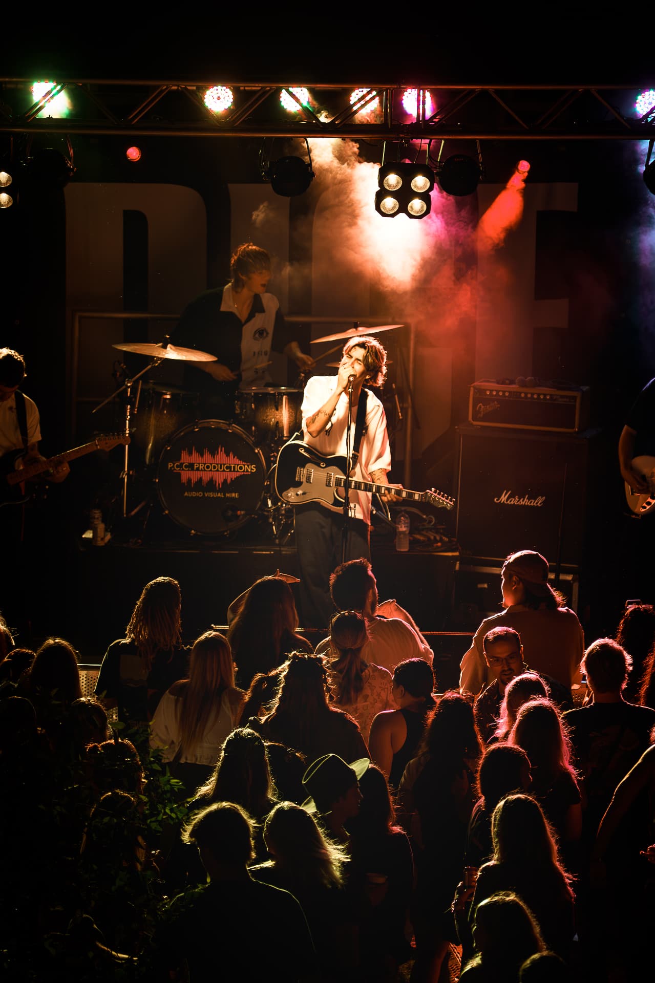 Band performing for a crowd at night