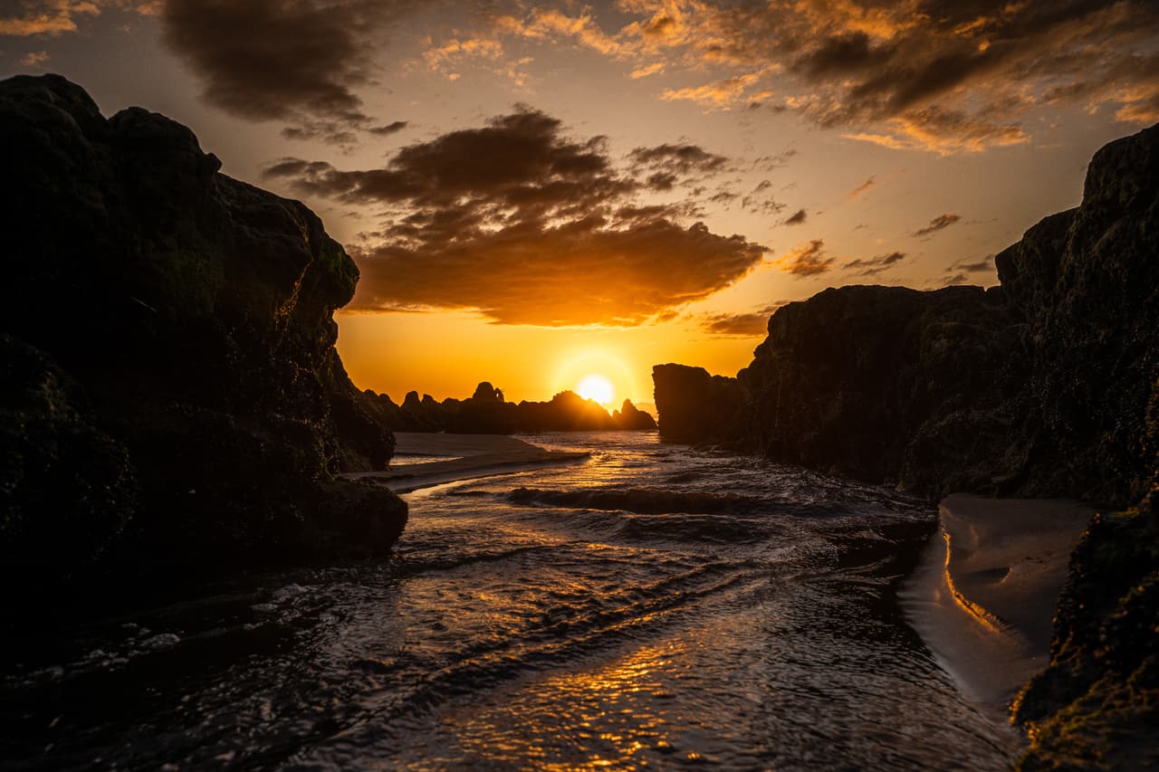 Golden sunset over a rocky shoreline