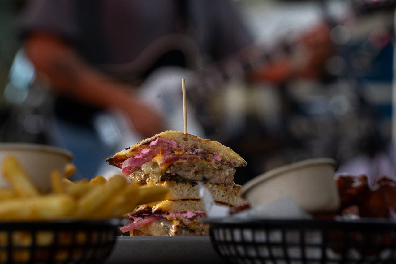 Stacked burger with fries at the venue